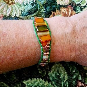 Handcrafted seed bead and leather bracelet